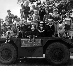 Some of the youngsters at the St Helens show enjoy a look over an armoured scout car Some of the youngsters at the St Helens show enjoy a look over an armoured scout car