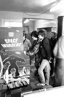 Youths play on a Space Invaders machine in Newcastle in December 1980 Youths play on a Space Invaders machine in Newcastle in December 1980
