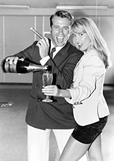 Yuppie couple drinking champagne and smoking cigars Yuppie couple drinking champagne and smoking cigars