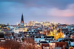 Netherlands Collection: Amsterdam, Netherlands historic cityscape with the modern Zuidas district in the distance at dusk