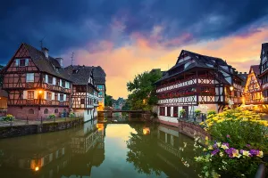 Prints of Strasbourg. Image of Strasbourg old town during dramatic sunset Landscapes Prints: Strasbourg Old Town Print at Sunset
