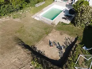 Drone Flight Print over a Greenery Pool