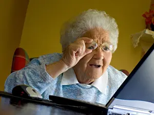Elderly Woman Amazed by Computer Screen Print