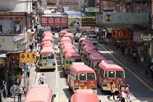 Hong Collection: Hong Kong, China - August 14, 2017: Minibuses lining up, waiting for passengers at a busy station