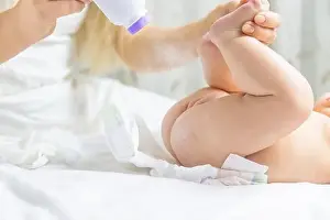 Mother Changing Babys Diaper Print