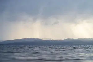 Print of Rays Through Clouds Over Water