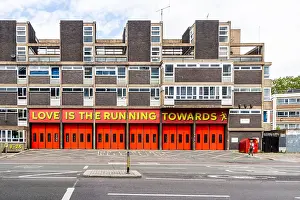 sign above shoreditch fire station old street london uk love is the running towards