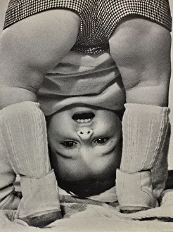 Child Playing Outdoors Prints: A child playing, bending over himself