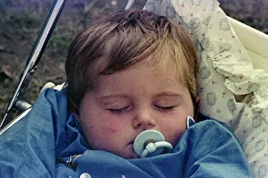 Child sleeping in pram