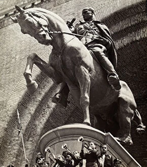 Images Dated 30th September 2014: Equestrian monument of Benito Mussolini. At the base, there is a group of children in the uniform