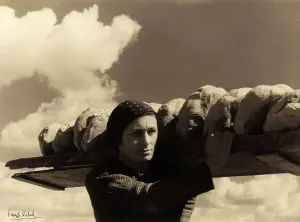 Il nostro pane'. Young woman carrying loaves of bread