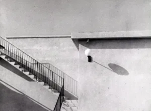 Building Facade Design Prints: Geometry'. Side part of a building with shadows projected on the wall