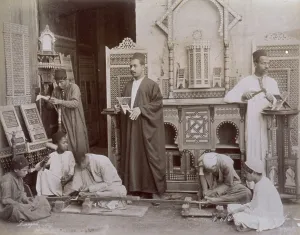 Group of egyptian carvers at work in a workshop
