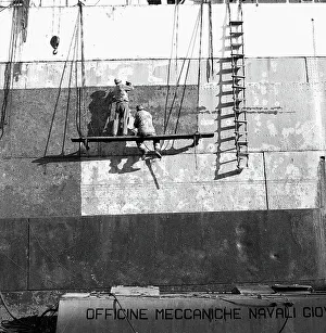 Men working on the hull of a ship