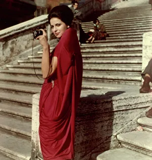 Model posing with a camera