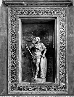 Framed Print : Niche with a rectangular frame decorated with spirals and acanthus-like leaves. Inside the niche is a full statue of the Duke Federico da Montefeltro dressed as a warrior. Work located on the large staircase of the Ducal Palace in Urbino Framed Print : Niche with a rectangular frame decorated with spirals and acanthus-like leaves. Inside the niche is a full statue of the Duke Federico da Montefeltro dressed as a warrior. Work located on the large staircase of the Ducal Palace in Urbino