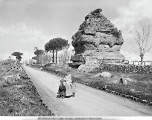 Images Dated 29th November 2017: Three peasants in front of the ruins of the 'pyramid' tomb along Via Appia Antica