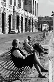 Images Dated 5th May 2016: People sitting on a bench in Malta
