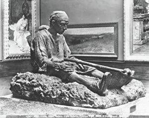 Pop art Collection: Sculpture entitled Proximus tuus portraying a farmer seated on the ground with a hoe between his