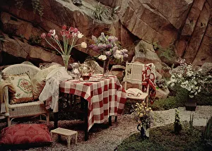 Table arrayed with vases of flowers
