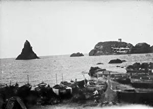 Small Boat Transportation Methods Prints: A view of the rocks of the Cyclops in Aci Trezza