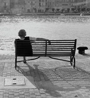 Images Dated 5th May 2016: Woman sitting on a bench in Malta
