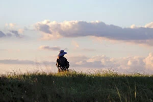 Grief Collection: Pensive woman on an open field