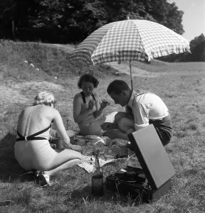 Freizeit Print: A Man and Two Women Under a Sun Umbrella, Germany 1930s