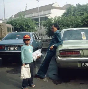 Print of a newsboy at work, Java, Indonesia 1980s