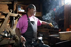 Blacksmith At Work Prints: Blacksmith working in his forge