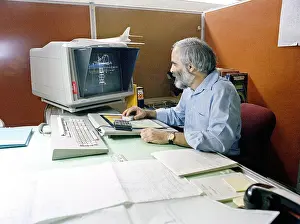 Prints of An engineer uses the computer aided design (CAD) system to develop the mount system for the tail section fo the B-1 bombers March Prints: Computer Aided Design Print of B-1 Bomber Tail Section Mount System