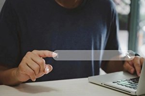 Man Typing On Laptop Prints: Man hand using computer touch virtual search icon