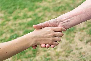Handshake Concept Prints: Old and young hands doing handshake
