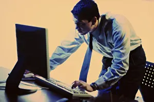 Formal Business Attire Prints: Side profile of a businessman using a computer
