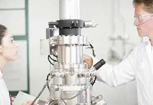 Laboratory Equipment Usage Prints: Scientists using equipment in lab