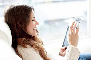 Prints of Woman using a tablet computer September Prints: Woman using a tablet computer Print