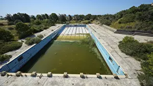 Graffiti Painting Greece Prints: Abandoned swimming pool with algae-infested water