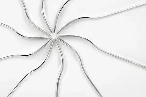 Isolated Studio Photography Prints: Abstract silver lines form a symmetrical pattern on a white background