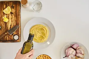 Hummus Recipe Prints: Adding olive oil to hummus, top view