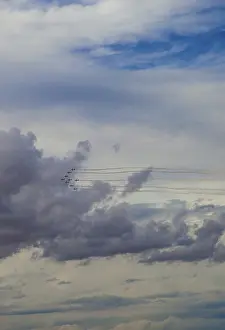 Aerial Display Prints: Aerobatic jets soar through a dramatic