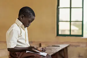 Child Learning Process Prints: African kid learning class