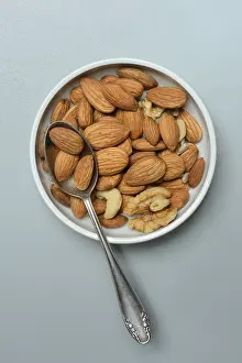 Food Photography Bowl Prints: Almonds and walnuts in shell with spoon