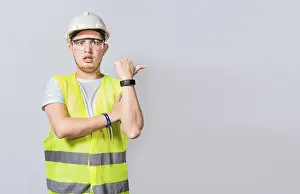 Construction Worker Pointing Prints: Amazed Engineer pointing to side