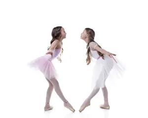 Elegant Dance Movements Prints: Amusing young ballerinas posing looking at each other
