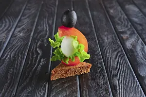 Black Table Still Life Prints: Appetizer for reception. Brown bread with quail egg