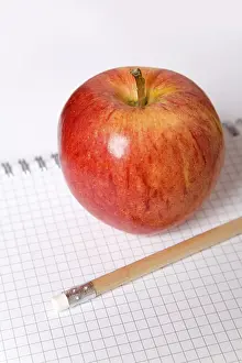 Still Life Photography Prints: Apple and a pencil on a note block