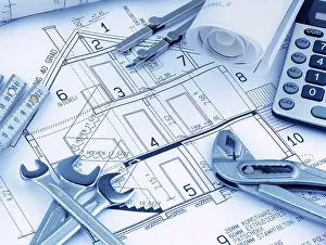 Architect Construction Plan Prints: An architect's construction plan with a calculator