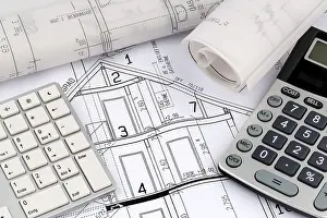 Architect Construction Plan Prints: An architect's construction plan with a calculator