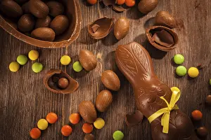 Easter Holiday Decoration Prints: Assorted chocolate for Easter on wooden background