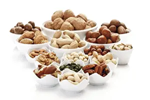 Ceramic Bowls Prints: Assorted nuts and kernels in ceramic bowls
